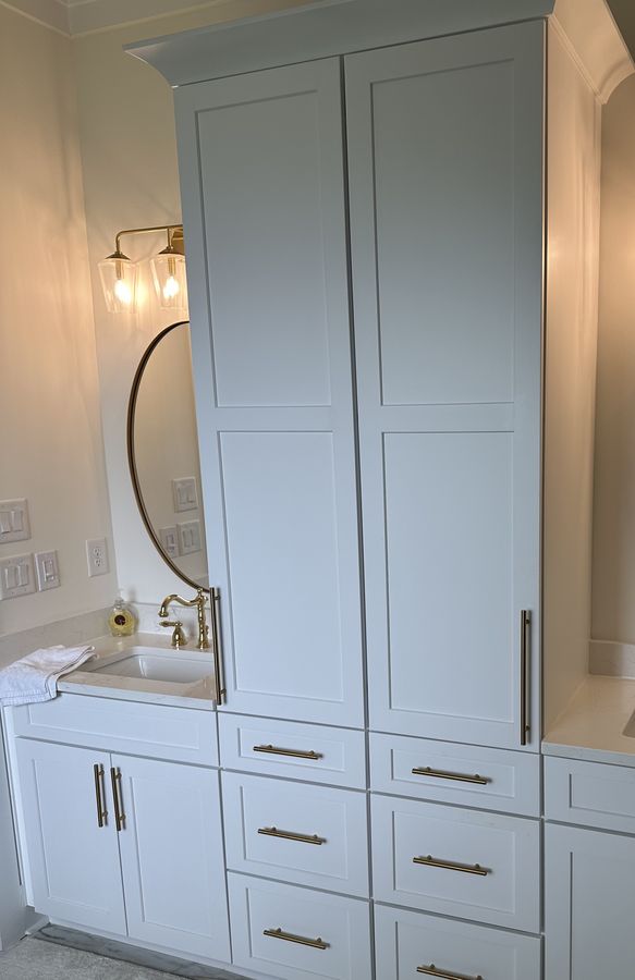 Master bath vanity with a full-height linen tower