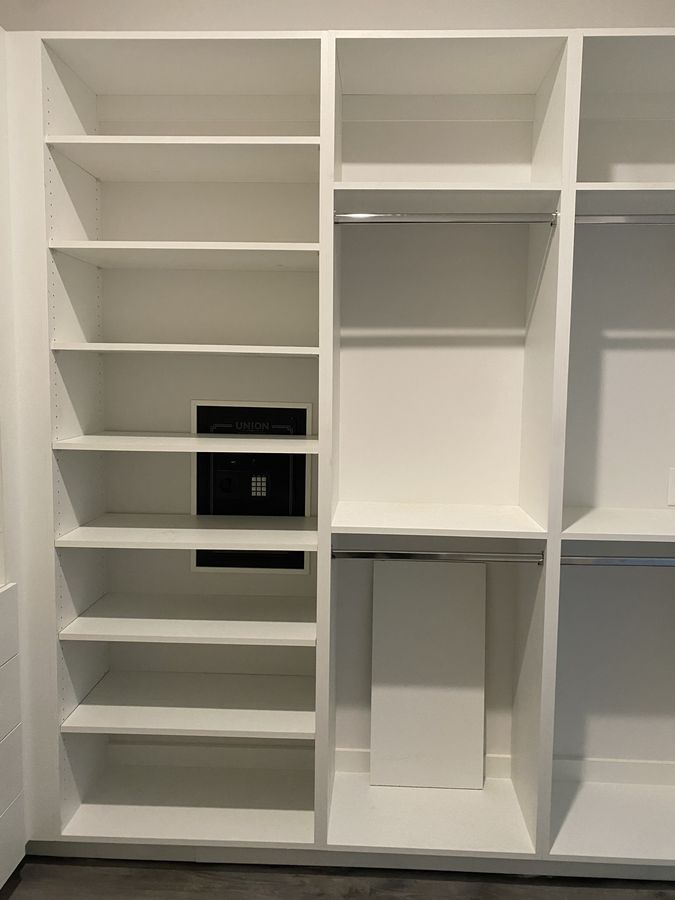 Shelving built around a concealed safe