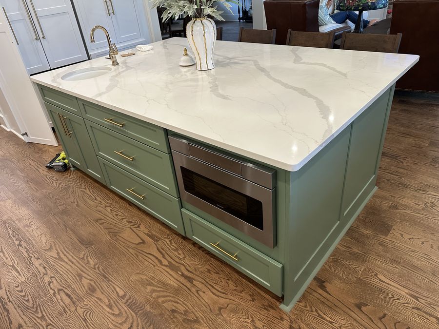 Island detail — inset panels and brass hardware